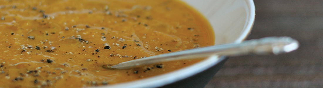 cginger A bowl of soup with a spoon in it