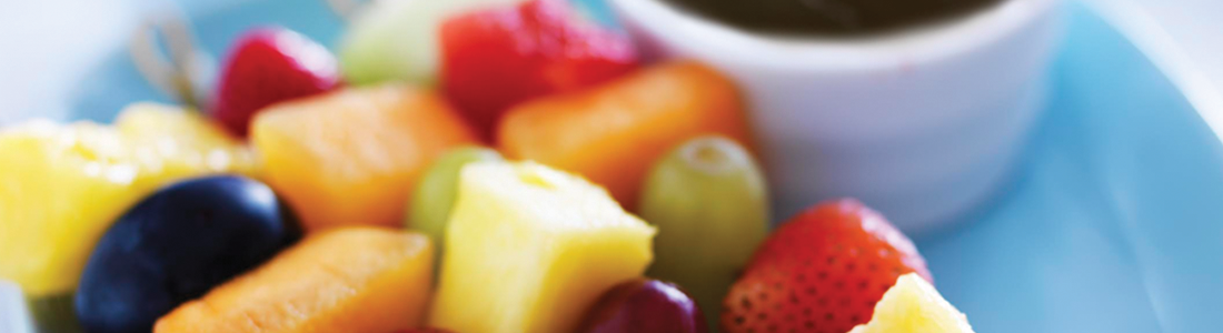 choco_0 A close up of a plate of fruit on a table