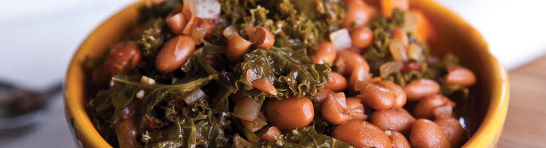 farmhouse A yellow bowl filled with beans and greens