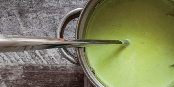 kale_1 A spoon sticking out of a green sauce in a pot