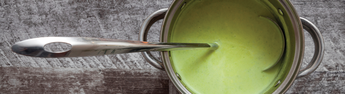 kale_1 A spoon sticking out of a green sauce in a pot
