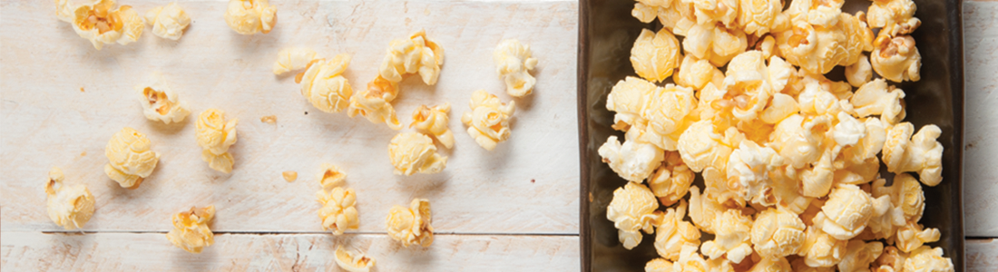 popcorn_1 A pan filled with popcorn sitting on top of a counter