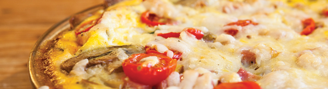 potato A close up of a pizza with tomatoes and cheese