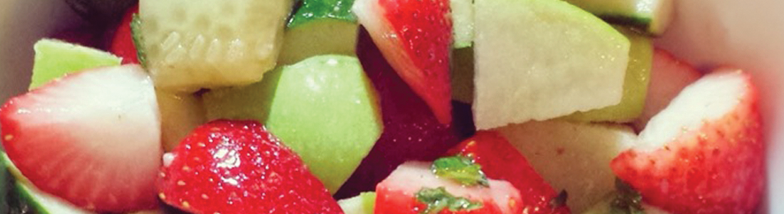 strawcucum A close up of a fruit salad in a bowl