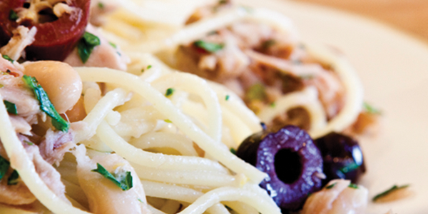 tunaolive A white plate topped with pasta covered in sauce