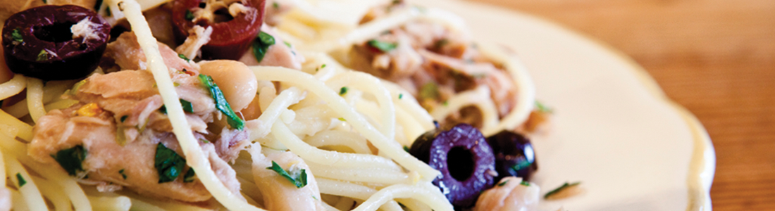 tunaolive A white plate topped with pasta covered in sauce