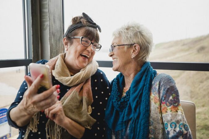 A couple of women standing next to each other