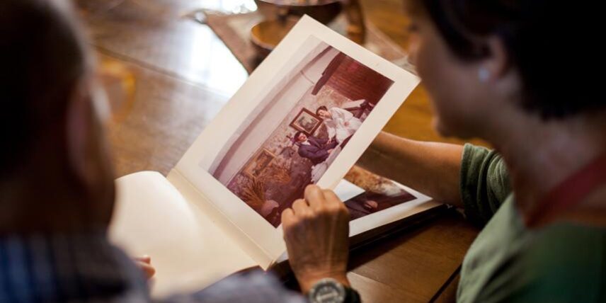 SharingMemories_1292549689_9 A man sitting at a table with an open book