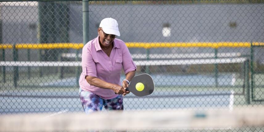 Sports_1443727127_7 A man swinging a tennis racquet at a tennis ball