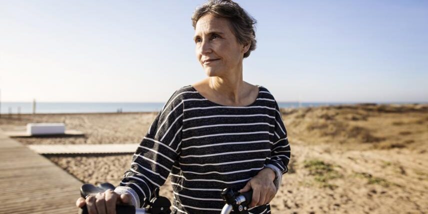 WaysYourBrainPowers_960937400_10 A woman riding a bike on a beach
