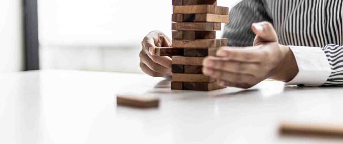 A,Woman,Is,Pulling,A,Block,Of,Wood,From,A